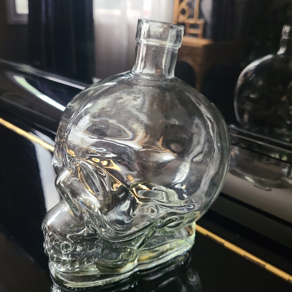 Scull clear glass empty bottle. Halloween decor.